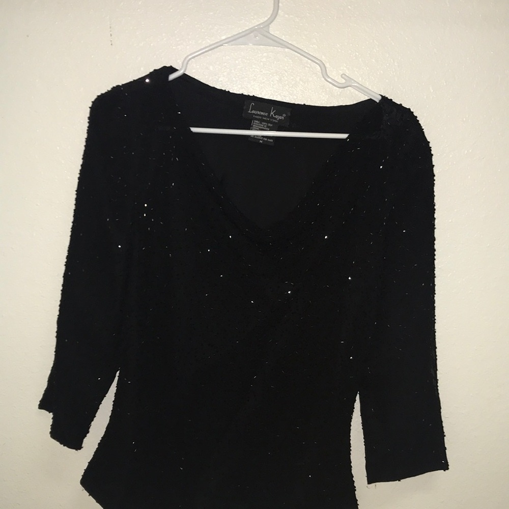 Black after five jeweled top by Laurence Kazar .